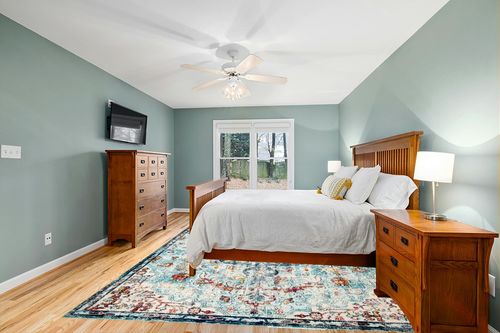 SAFAVIEH Madison Collection Area Rug - 9' x 12', Navy & Light Blue, Boho Chic Medallion Distressed Design, Non-Shedding & Easy Care, Ideal for High Traffic Areas in Living Room, Bedroom (MAD447K) in Teal and Orange Wood Bedroom