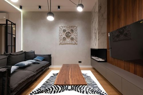 Sunshine Cowhides Genuine Safari Zebra Print Cowhide Rug - Luxurious Cow Rug for Bedroom, Living Room, and Home Decor Enthusiasts - Masterpiece of Style and Functionality - 6x7ft (180x210cm) in Dark Wood Living Room with Black Couch