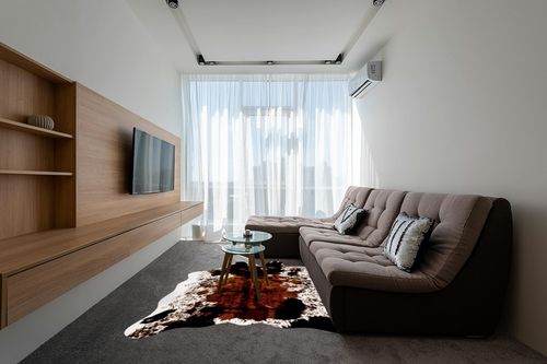 CONBEN Oversized Faux Cowhide Rug (6.3ft x 8.3ft) - Non-Slip Backing, Cow Print Decor - Farmhouse, Western Floor Rugs for Living Room, Bedroom, Dining Area or Office in Grey Living Room with Brown Couch