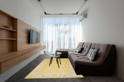 SAFAVIEH Stone Wash Collection 6' x 9' Yellow STW213A Hand-Knotted Premium Wool & Viscose Area Rug in Grey Living Room with Brown Couch