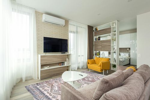 nuLOOM Mae Tribal Motif Machine Washable Area Rug in Light Modern Living Room with TV