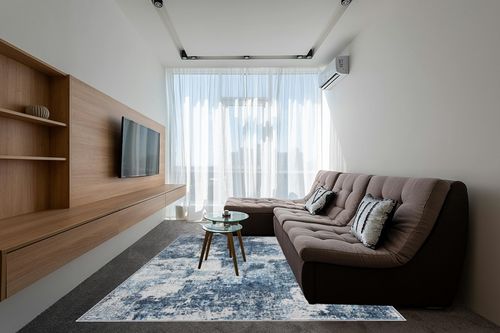 Area Rug Living Room Rugs: 5x7 Washable Rug with Anti-Slip Backing Non-Shedding Stain-Resistant Foldable Modern Abstract Carpet for Bedroom Dining Room Nursery Home Office (Blue) in Grey Living Room with Brown Couch