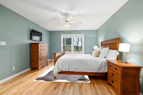 Appaloosa Cowhides Color Dyed Collection (Soft Gray) in Teal and Orange Wood Bedroom