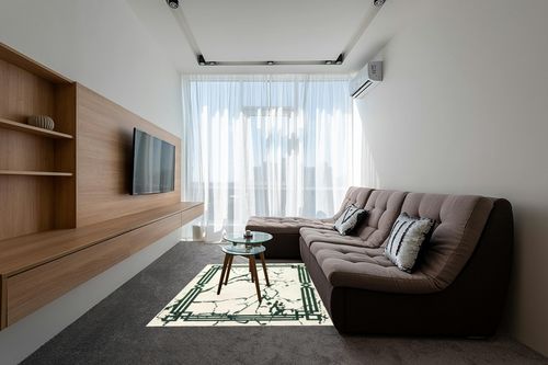 Antep Rugs Babil Gold 5x7 Abstract Marble Geometric Indoor Area Rug (Green Cream, 5'3" x 7') in Grey Living Room with Brown Couch