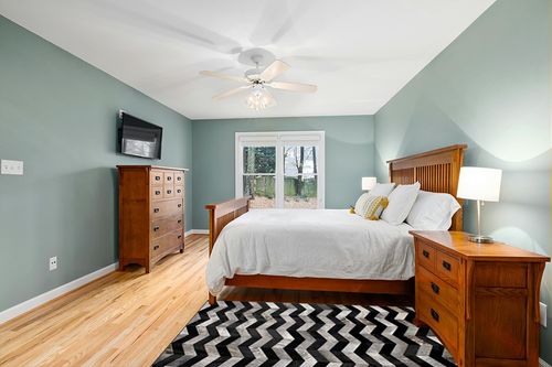 Premiumcowhide New Cowhide Rug Leather. Animal Skin Patchwork Area Carpet (4 x 6) in Teal and Orange Wood Bedroom