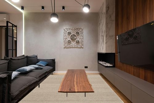 SAFAVIEH Natura Collection Area Rug - 9' x 12', Beige, Handmade Wool, Ideal for High Traffic Areas in Living Room, Bedroom (NAT801B) in Dark Wood Living Room with Black Couch