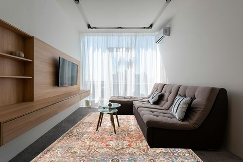 Loloi II Loren Terracotta/Sky 8'-4" x 11'-6" Area Rug in Grey Living Room with Brown Couch