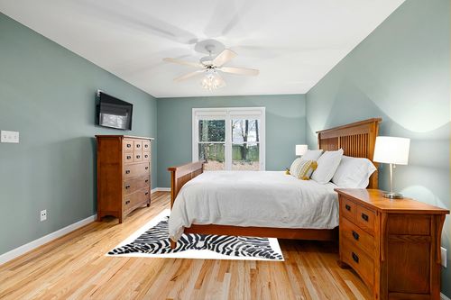 Sunshine Cowhides Genuine Safari Zebra Print Cowhide Rug - Luxurious Cow Rug for Bedroom, Living Room, and Home Decor Enthusiasts - Masterpiece of Style and Functionality - 6x7ft (180x210cm) in Teal and Orange Wood Bedroom