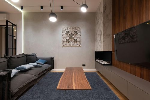 Super Soft Plush Large Rug in Dark Wood Living Room with Black Couch