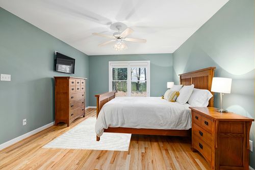 Orren Ellis Montpetit Hand-Woven Off White Area Rug, Size: Rectangle 5' x 8' in Teal and Orange Wood Bedroom
