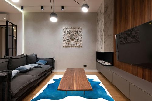 Natural Geneva Cowhide Area Rugs for Living Room and Bedroom | Handmade 100% Cow Rug with Low Pile | Shed-Resistant Home and Office Rug, Sky Blue, 6 ft x 7 ft in Dark Wood Living Room with Black Couch