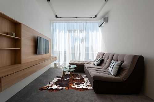 Prime Cowhides Cowhide Rug Tricolor Genuine Hair on Hide Size: Medium (5ft x 6ft) (150cm x 180cm) in Grey Living Room with Brown Couch