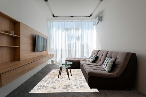 nuLOOM Danae Abstract Machine Washable Area Rug, 6x9, Ivory in Grey Living Room with Brown Couch