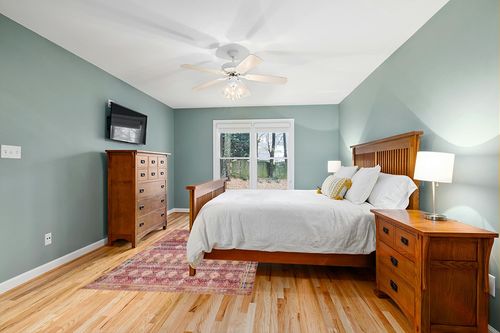 Loloi II Layla Collection LAY-15 Magenta/Multi, Traditional 5'-0" x 7'-6" Area Rug in Teal and Orange Wood Bedroom