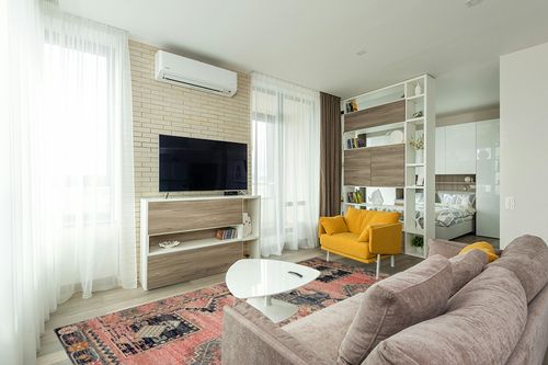 Loloi II Jocelyn Collection JOC-06 Rose/Rose 7'-10" x 10' Area Rug in Light Modern Living Room with TV