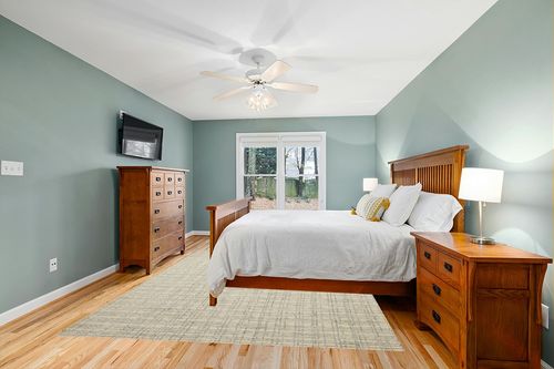 Chris Loves Julia x Loloi Polly Collection POL-03 Antique / Mist 7'-9" x 9'-9" Area Rug in Teal and Orange Wood Bedroom
