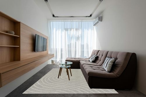 LUXE WEAVERS Modern Geometric Wave Gray 8x10 Area Rug in Grey Living Room with Brown Couch