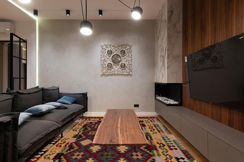 SAFAVIEH Aspen Collection Area Rug - 8' x 10', Red & Yellow, Handmade Boho Tribal Southwestern Wool, Ideal for High Traffic Areas in Living Room, Bedroom (APN404Q) in Dark Wood Living Room with Black Couch