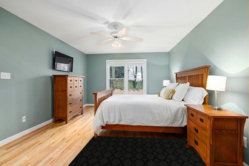 Garland Rug Sparta 4 ft. x 6 ft. Area Rug Black in Teal and Orange Wood Bedroom