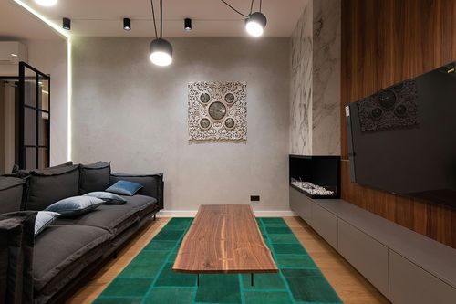 BESPOKY 6'5" x 9'8" (195x295 Cm) Teselya Green Patchwork Wool Handmade Area Rug in Dark Wood Living Room with Black Couch