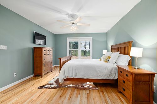 Sunshine Cowhides Genuine Brindle Tricolor Cowhide Rug - Luxurious Cow Rug for Bedroom, Living Room, and Home Decor Enthusiasts - Masterpiece of Style and Functionality - 6x6-7ft (180x210cm) in Teal and Orange Wood Bedroom