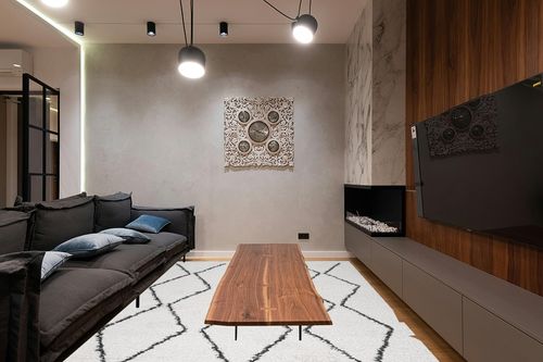 Moroccan Diamond Pattern Indoor Rug 8 X 10 in Dark Wood Living Room with Black Couch