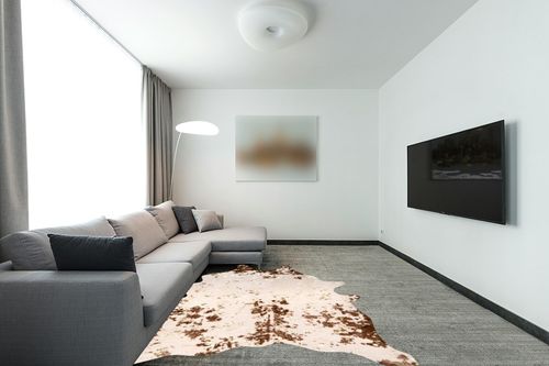 nuLOOM Iraida Contemporary Faux Cowhide Area Rug, 5' x 6' 7", Brown in Modern Living Room with Grey Couch