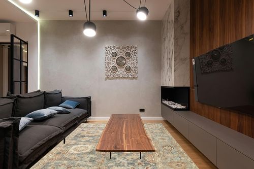 ‎Ocean / Spice ‎Traditional   ‎Area Rug in Dark Wood Living Room with Black Couch