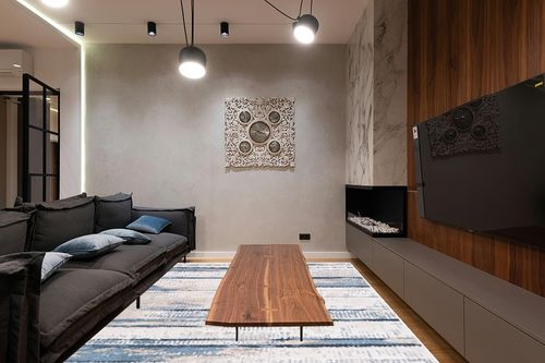 Safavieh Bayside Collection Area Rug - 9' x 12', Blue & Gold, Modern Design, Non-Shedding & Easy Care, Machine Washable Ideal for High Traffic Areas in Living Room, Bedroom (BAY130M) in Dark Wood Living Room with Black Couch