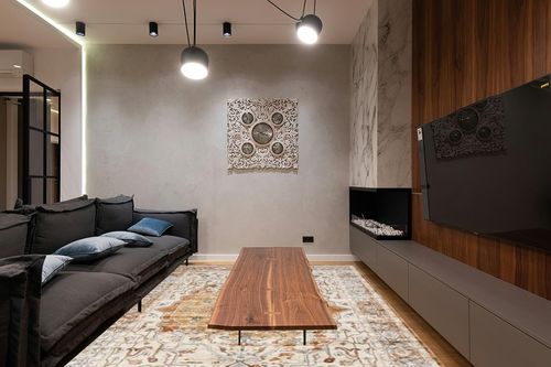 befbee 8x10 Area Rugs for Living Room, Stain Resistant Neutral Washable Rugs for Dining Room, Floral Vintage Non-Slip Thin Large Size Area Rug (Orange/Yellow) in Dark Wood Living Room with Black Couch