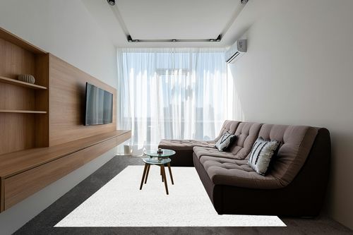 White 8x10  Shag Rug in Grey Living Room with Brown Couch