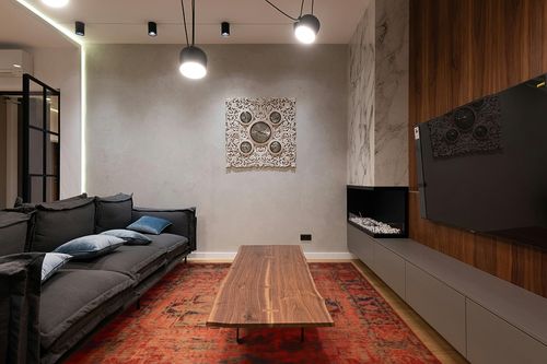 NEATIIP Bohemian Machine Washable 8x10 Area Rugs for Living Room, Non Slip Boho Soft Dorm Rug, Low Pile Dining Office Mat Non-Shedding Indoor Carpet for Bedroom Orange Red/Yellow in Dark Wood Living Room with Black Couch