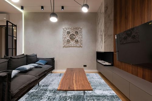 HOMBYS 9x12 Modern Area Rug for Living Room Bedroom, Large Boho Floor Carpet with Non-Slip Backing for Indoor Office Dining Room, Abstract Home Deco Non-Shedding, Green, Machine Washable in Dark Wood Living Room with Black Couch