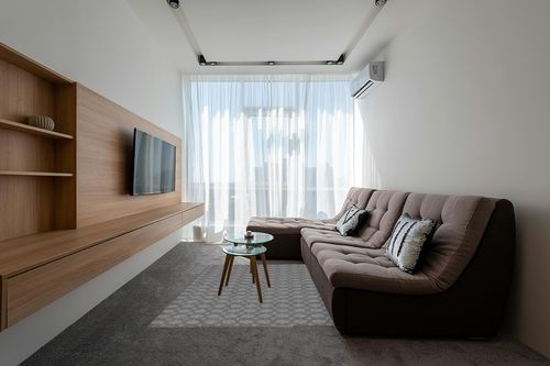 Garland Rug Garden Trellis 5 ft. x 7 ft. Indoor/Outdoor Area Rug Heather Gray in Grey Living Room with Brown Couch