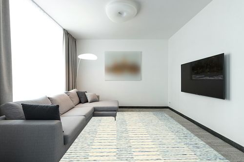 Loloi Chris Loves Julia x Chris Ivory/Denim 8'-6" x 11'-6" Area Rug in Modern Living Room with Grey Couch