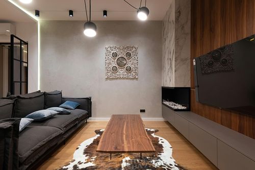 HIDES BAZAAR Brown Brindle Cowhide Rug, Premium Quality Genuine Leather Cow Hide, Brown, Black and White Area Rug (6x8 ft) in Dark Wood Living Room with Black Couch