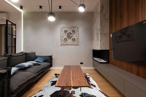 Genuine Tricolor Cowhide Rug XL 6 x 7-8 ft. - 180 x 240cm in Dark Wood Living Room with Black Couch