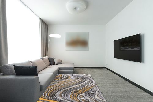 Rugshop Contemporary Abstract Swirl Stain Resistant Soft Area Rug 5' x 7' Yellow in Modern Living Room with Grey Couch
