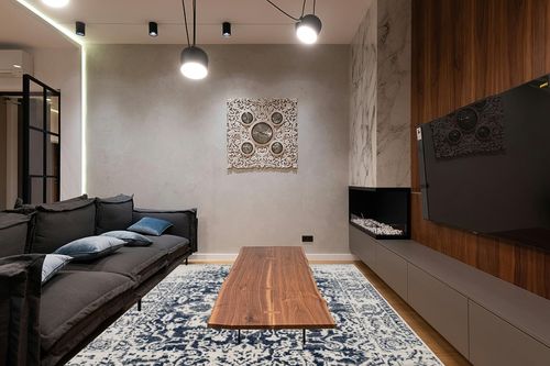 SAFAVIEH Madison Collection Area Rug - 8' x 10', Cream & Navy, Snowflake Medallion Distressed Design, Non-Shedding & Easy Care, Ideal for High Traffic Areas in Living Room, Bedroom (MAD603D) in Dark Wood Living Room with Black Couch