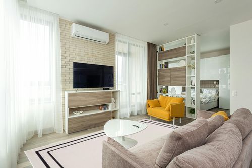 Nourison Essentials Indoor/Outdoor Solid Bordered Ivory/Black 8' x 10' Area Rug, Easy Cleaning, Non Shedding, Bed Room, Living Room, Dining Room, Backyard, Deck, Patio (8x10) in Light Modern Living Room with TV