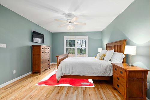 Appaloosa Cowhides Color Dyed Collection (Rusty Red) in Teal and Orange Wood Bedroom