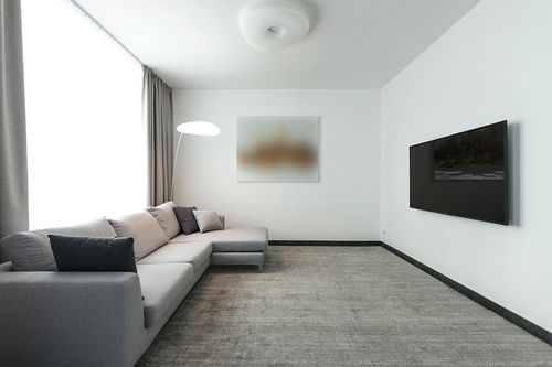 SAFAVIEH Textural Collection Area Rug - 6' x 9', Ivory, Handmade Wool, Ideal for High Traffic Areas in Living Room, Bedroom (TXT101A) in Modern Living Room with Grey Couch