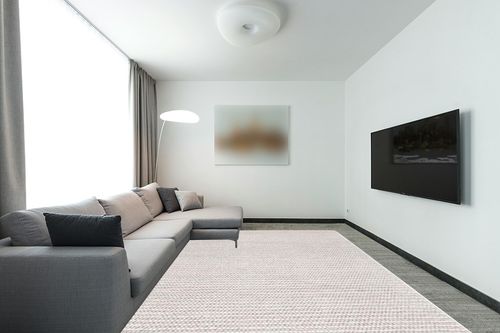 SAFAVIEH Natura Collection Area Rug - 9' x 12', Ivory & Beige, Handmade Farmhouse Boho Wool, Ideal for High Traffic Areas in Living Room, Bedroom (NAT220B) in Modern Living Room with Grey Couch