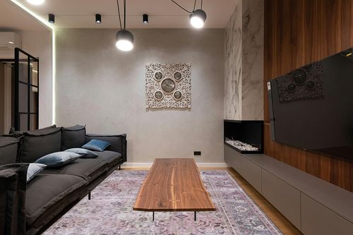 SAFAVIEH Tucson Collection Area Rug - 9' x 12', Pink & Beige, Persian Design, Non-Shedding Machine Washable & Slip Resistant Ideal for High Traffic Areas in Living Room, Bedroom (TSN144U) in Dark Wood Living Room with Black Couch