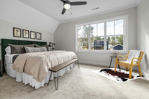 MustMat Faux Cowhide Rug 4.6'x5.2' Cute and Soft Animal Print Area Rug for Living Room/Bedroom/Dining Room in Grey Traditional Bedroom with King Bed