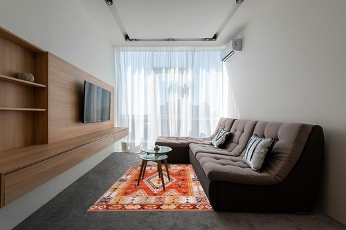 nuLOOM Reda Aztec Bordered Machine Washable Ultra Thin Area Rug, 5' x 8', Burnt Orange in Grey Living Room with Brown Couch