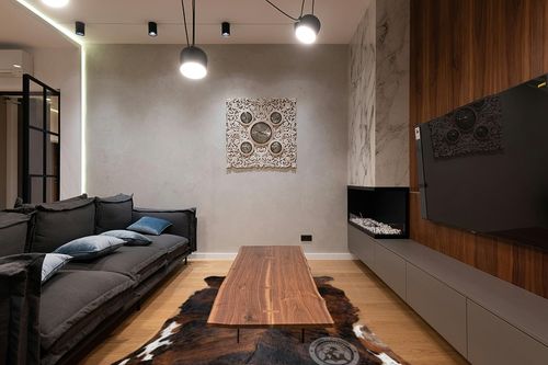 Genuine Brindle Cowhide Rug XL 6 x 7-8 ft. 180 x 240 cm in Dark Wood Living Room with Black Couch