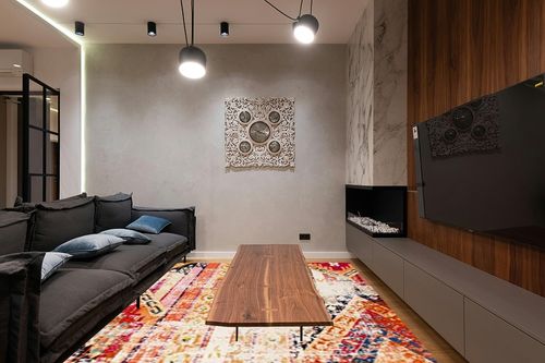 SAFAVIEH Monaco Collection Area Rug - 9' x 12', Orange & Multi, Boho Chic Tribal Distressed Design, Non-Shedding & Easy Care, Ideal for High Traffic Areas in Living Room, Bedroom (MNC222H) in Dark Wood Living Room with Black Couch