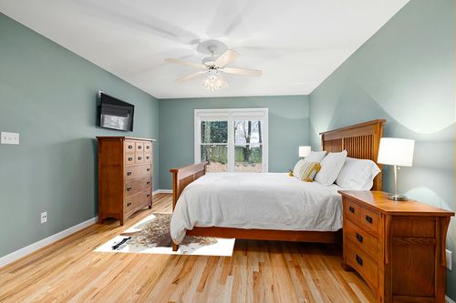 Gaucho Cowhides Natural Snowie Brown and White in Teal and Orange Wood Bedroom