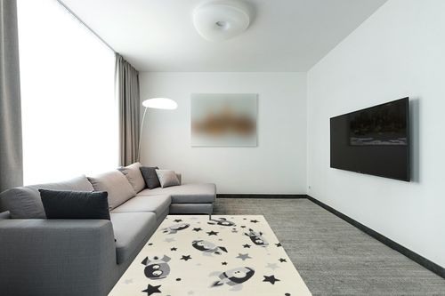 Mod-Tod Rocket Dreams Kids Area Rug - 5'3" x 7' in Modern Living Room with Grey Couch